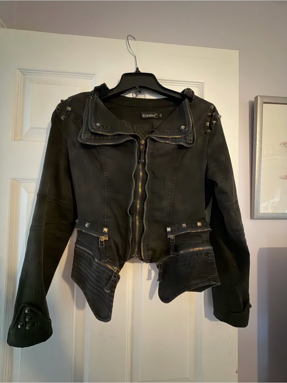 Studded Black Leather Moto Jacket with Asymmetrical Hem